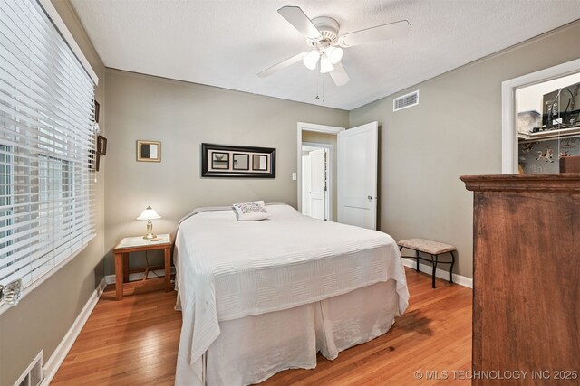 1347 E 37th St, Tulsa, OK 74105 - bedroom featuring wood finished floors and a ceiling fan