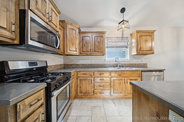 311 E 4th St, Skiatook, OK 74070 - kitchen with appliances with stainless steel finishes, dark countertops, and decorative light fixtures
