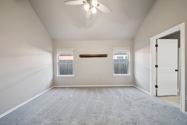 311 E 4th St, Skiatook, OK 74070 - unfurnished room featuring lofted ceiling, a ceiling fan, and carpet flooring