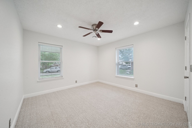 13111 E 80th St N, Owasso, OK 74055 - spare room with carpet flooring, healthy amount of natural light, recessed lighting, ceiling fan, and a textured ceiling