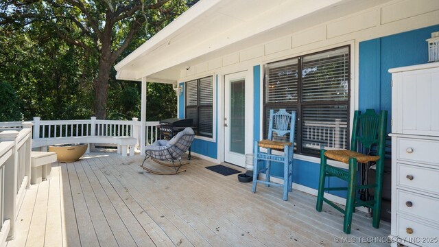 3942 Elm Dr, Kingston, OK 73439 - wooden terrace with grilling area