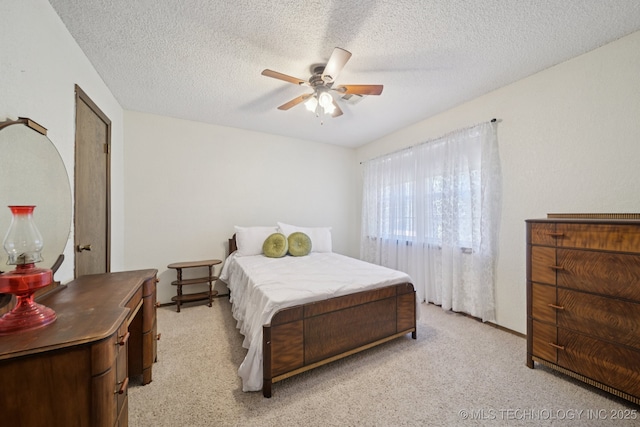2519 W 53rd St, Tulsa, OK 74107 - bedroom featuring light colored carpet, ceiling fan, and a textured ceiling