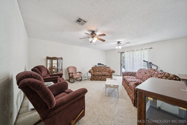 2519 W 53rd St, Tulsa, OK 74107 - carpeted living room featuring ceiling fan and a textured ceiling