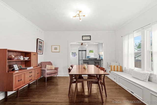 1144 S Owasso Ave, Tulsa, OK 74120 - dining room with dark wood-style flooring, crown molding, and plenty of natural light