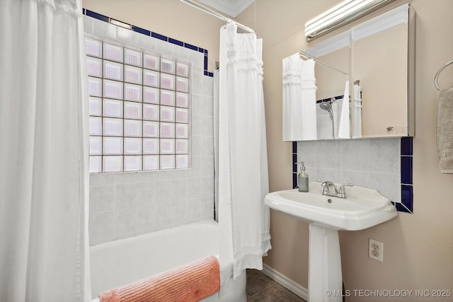 1144 S Owasso Ave, Tulsa, OK 74120 - bathroom featuring decorative backsplash, shower / tub combo, and tile patterned flooring