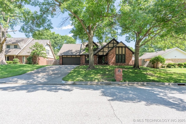 5833 E 78th Pl, Tulsa, OK 74136 - tudor home featuring driveway, brick siding, and a garage