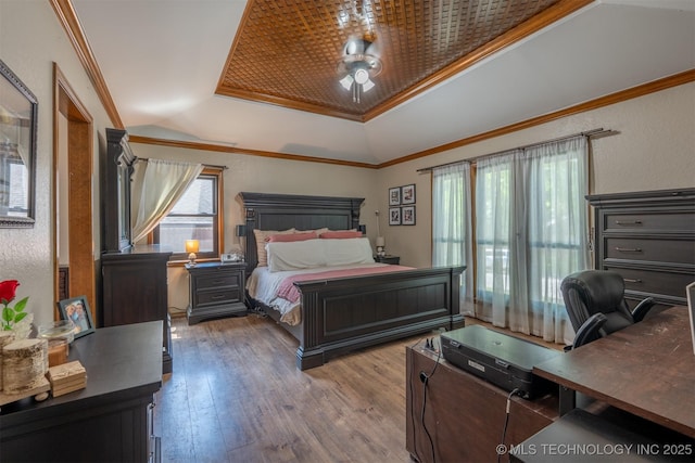 5833 E 78th Pl, Tulsa, OK 74136 - bedroom with a raised ceiling, hardwood / wood-style flooring, a desk, and ornamental molding