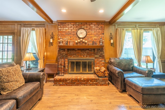 5833 E 78th Pl, Tulsa, OK 74136 - living room featuring ornamental molding, wood finished floors, beam ceiling, a brick fireplace, and ceiling fan