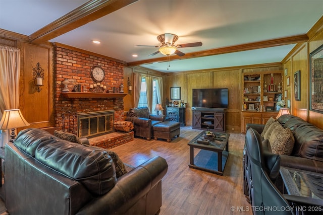 5833 E 78th Pl, Tulsa, OK 74136 - living room with a fireplace, ornamental molding, ceiling fan, wood finished floors, and wood walls