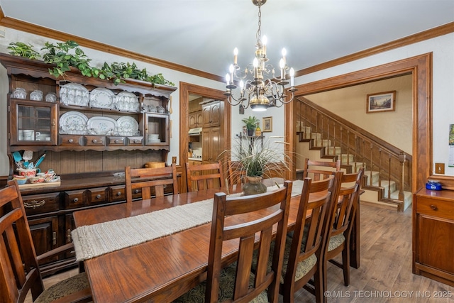5833 E 78th Pl, Tulsa, OK 74136 - dining room with a chandelier, stairs, wood finished floors, and ornamental molding