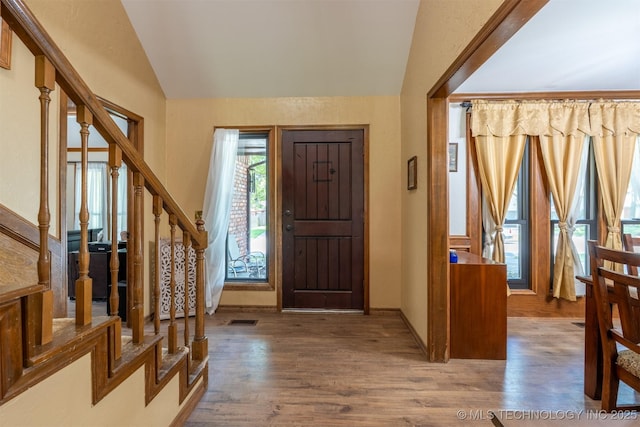 5833 E 78th Pl, Tulsa, OK 74136 - entrance foyer with vaulted ceiling, wood finished floors, and stairs