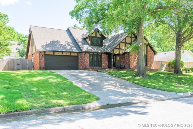 5833 E 78th Pl, Tulsa, OK 74136 - tudor-style house with a garage, concrete driveway, brick siding, and a gate
