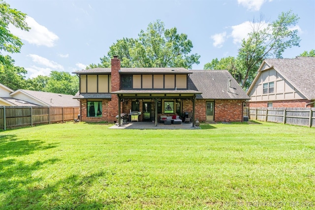 5833 E 78th Pl, Tulsa, OK 74136 - rear view of property with a patio area, a chimney, a fenced backyard, and brick siding