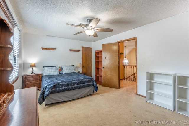 5833 E 78th Pl, Tulsa, OK 74136 - carpeted bedroom featuring a textured ceiling and ceiling fan