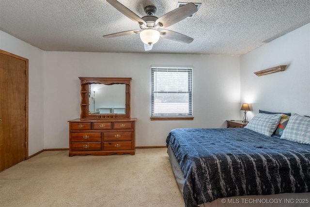 5833 E 78th Pl, Tulsa, OK 74136 - bedroom featuring light colored carpet, a ceiling fan, and a textured ceiling