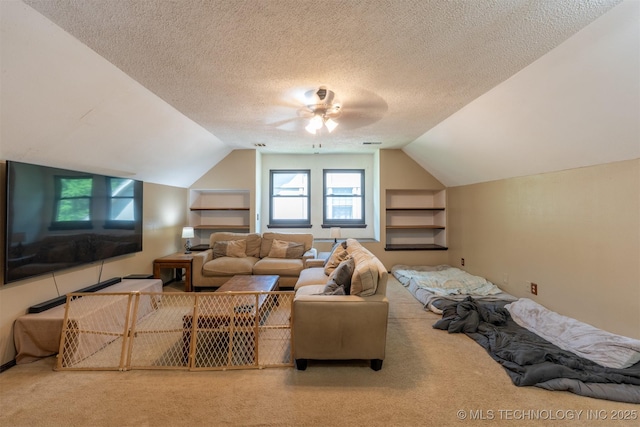 5833 E 78th Pl, Tulsa, OK 74136 - living room with carpet floors, ceiling fan, vaulted ceiling, and a textured ceiling