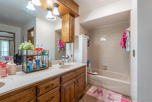 5833 E 78th Pl, Tulsa, OK 74136 - bathroom with double vanity, wood finished floors, and shower / tub combination