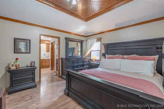5833 E 78th Pl, Tulsa, OK 74136 - bedroom with crown molding, light wood finished floors, a raised ceiling, and ensuite bath