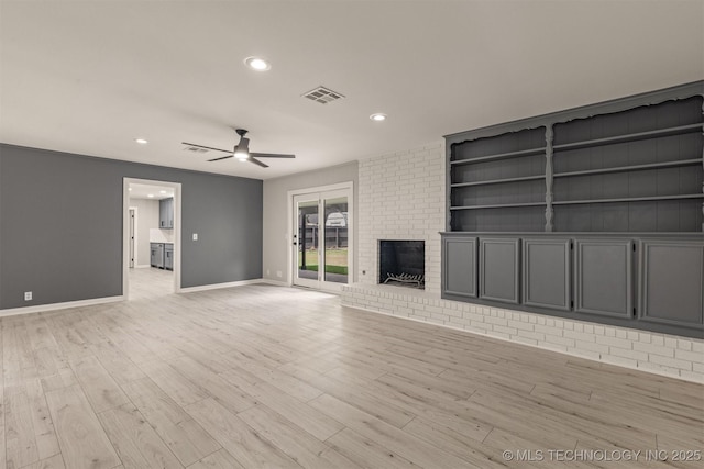 9421 S 69th E Ave, Tulsa, OK 74133 - unfurnished living room featuring a ceiling fan, recessed lighting, a brick fireplace, and light wood-style flooring