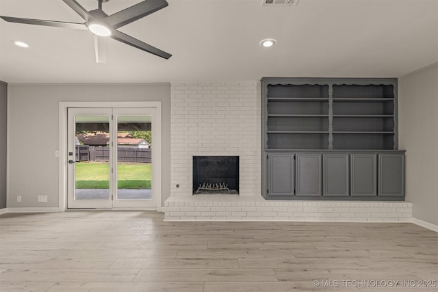 9421 S 69th E Ave, Tulsa, OK 74133 - unfurnished living room with ceiling fan, light wood-style floors, a fireplace, and recessed lighting
