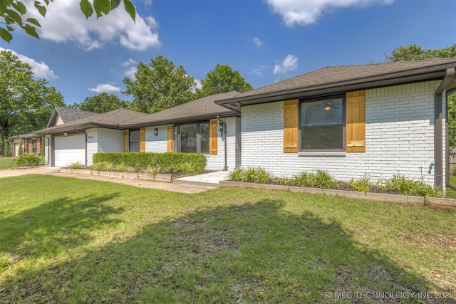 9421 S 69th E Ave, Tulsa, OK 74133 - ranch-style house featuring brick siding, an attached garage, a front yard, and a shingled roof