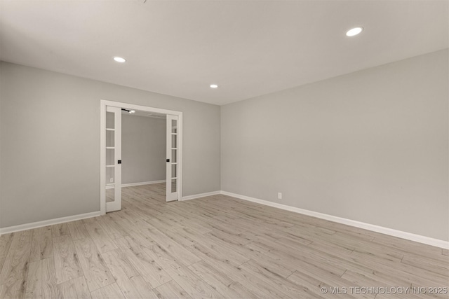 9421 S 69th E Ave, Tulsa, OK 74133 - empty room featuring french doors, recessed lighting, and wood finished floors