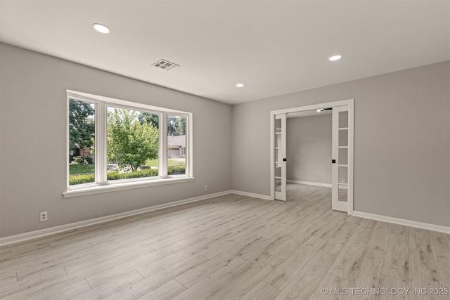 9421 S 69th E Ave, Tulsa, OK 74133 - unfurnished room with recessed lighting, light wood-type flooring, and french doors