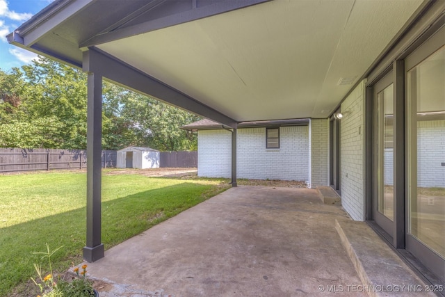 9421 S 69th E Ave, Tulsa, OK 74133 - fenced backyard with a patio area and a shed