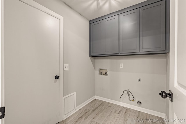 9421 S 69th E Ave, Tulsa, OK 74133 - laundry room featuring hookup for an electric dryer, light wood-type flooring, washer hookup, cabinet space, and gas dryer hookup