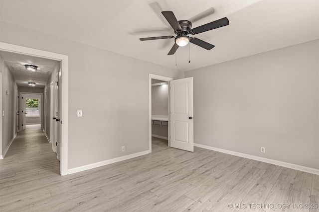 9421 S 69th E Ave, Tulsa, OK 74133 - unfurnished bedroom featuring light wood-type flooring and a ceiling fan