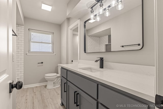 9421 S 69th E Ave, Tulsa, OK 74133 - bathroom featuring vanity, a shower, and wood finished floors