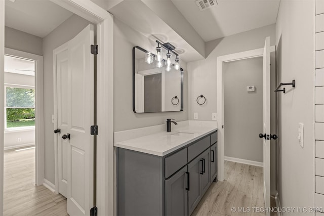 9421 S 69th E Ave, Tulsa, OK 74133 - bathroom with wood finished floors and vanity