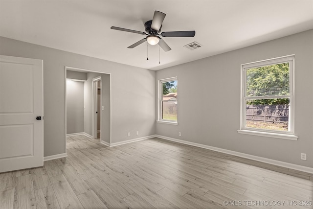 9421 S 69th E Ave, Tulsa, OK 74133 - unfurnished room featuring ceiling fan, healthy amount of natural light, and light wood-style floors