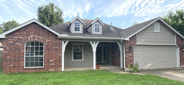 2109 W Maple St, Collinsville, OK 74021 - view of front of house with covered porch, brick siding, an attached garage, driveway, and roof with shingles