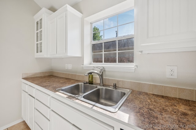 2109 W Maple St, Collinsville, OK 74021 - kitchen featuring white cabinetry and glass insert cabinets