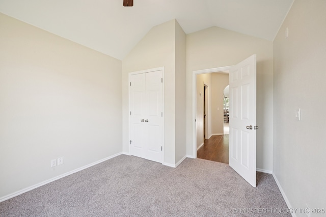 2109 W Maple St, Collinsville, OK 74021 - unfurnished bedroom with carpet, lofted ceiling, a ceiling fan, and a closet