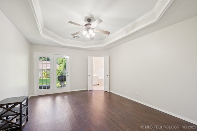 2109 W Maple St, Collinsville, OK 74021 - unfurnished room featuring a raised ceiling, ornamental molding, a ceiling fan, and dark wood-style floors