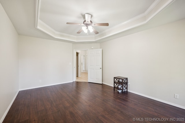 2109 W Maple St, Collinsville, OK 74021 - empty room with a raised ceiling, a ceiling fan, wood finished floors, and ornamental molding