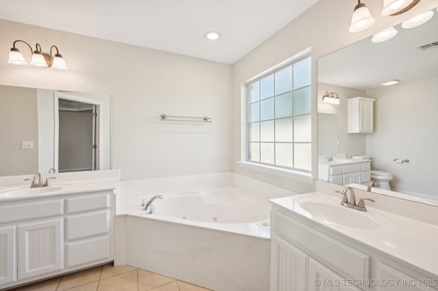2109 W Maple St, Collinsville, OK 74021 - bathroom with two vanities, tile patterned flooring, and a tub with jets