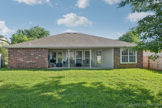 2109 W Maple St, Collinsville, OK 74021 - rear view of property with brick siding, a patio, and roof with shingles