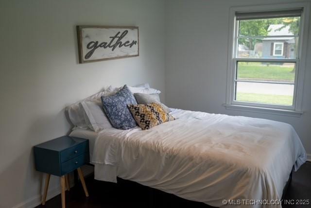 4621 Riverside Dr, Tulsa, OK 74105 - bedroom with baseboards and wood finished floors