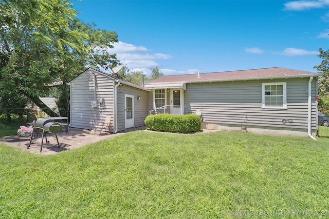 1332 E 42nd St, Tulsa, OK 74105 - rear view of property featuring a patio and a lawn