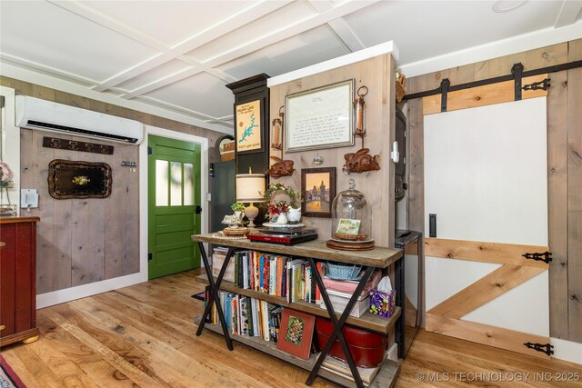 453805 E 315th Rd, Afton, OK 74331 - corridor featuring a wall mounted AC, a barn door, wood finished floors, coffered ceiling, and wood walls