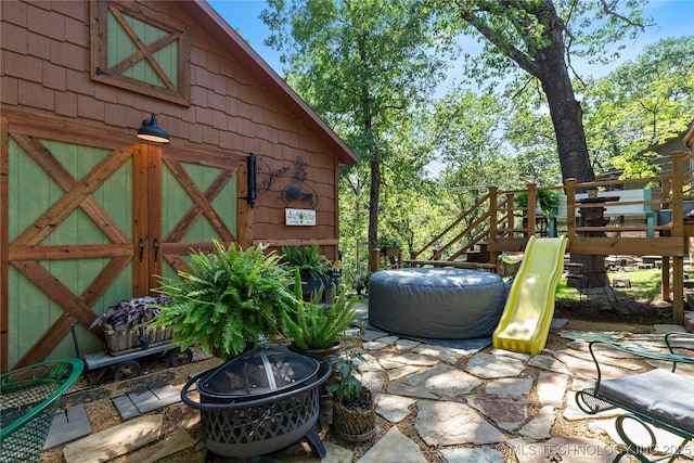 453805 E 315th Rd, Afton, OK 74331 - view of patio with an outdoor fire pit and a playground