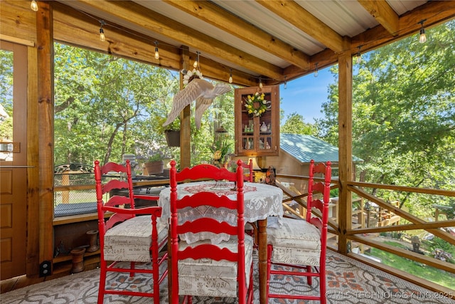 453805 E 315th Rd, Afton, OK 74331 - sunroom featuring beamed ceiling, plenty of natural light, and a wooden deck