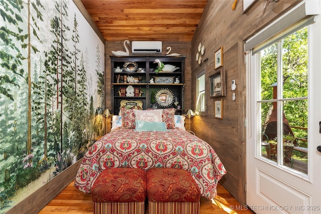 453805 E 315th Rd, Afton, OK 74331 - bedroom with lofted ceiling, wooden ceiling, wooden walls, a wall mounted air conditioner, and wood finished floors