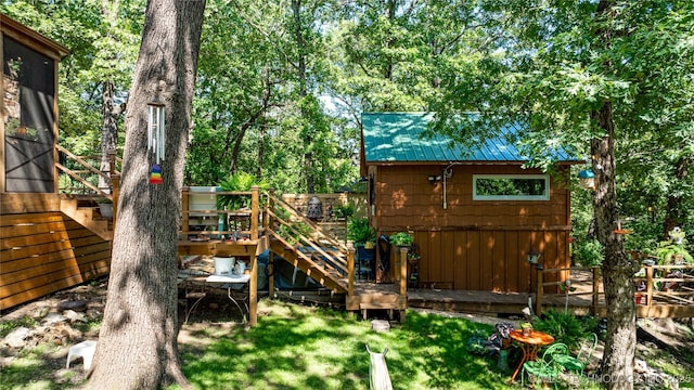 453805 E 315th Rd, Afton, OK 74331 - view of jungle gym with a wooden deck, stairs, and an outbuilding
