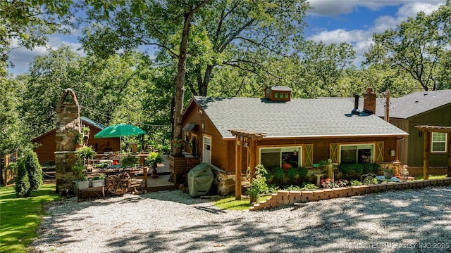 453805 E 315th Rd, Afton, OK 74331 - rustic home with roof with shingles, a deck, and a chimney