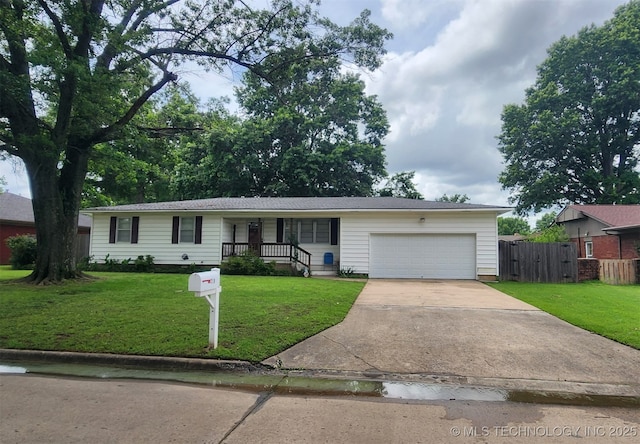 219 N Anthony St, Muskogee, OK 74403 - ranch-style house with driveway, an attached garage, and covered porch