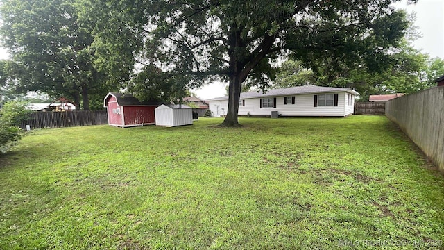 219 N Anthony St, Muskogee, OK 74403 - fenced backyard featuring a shed